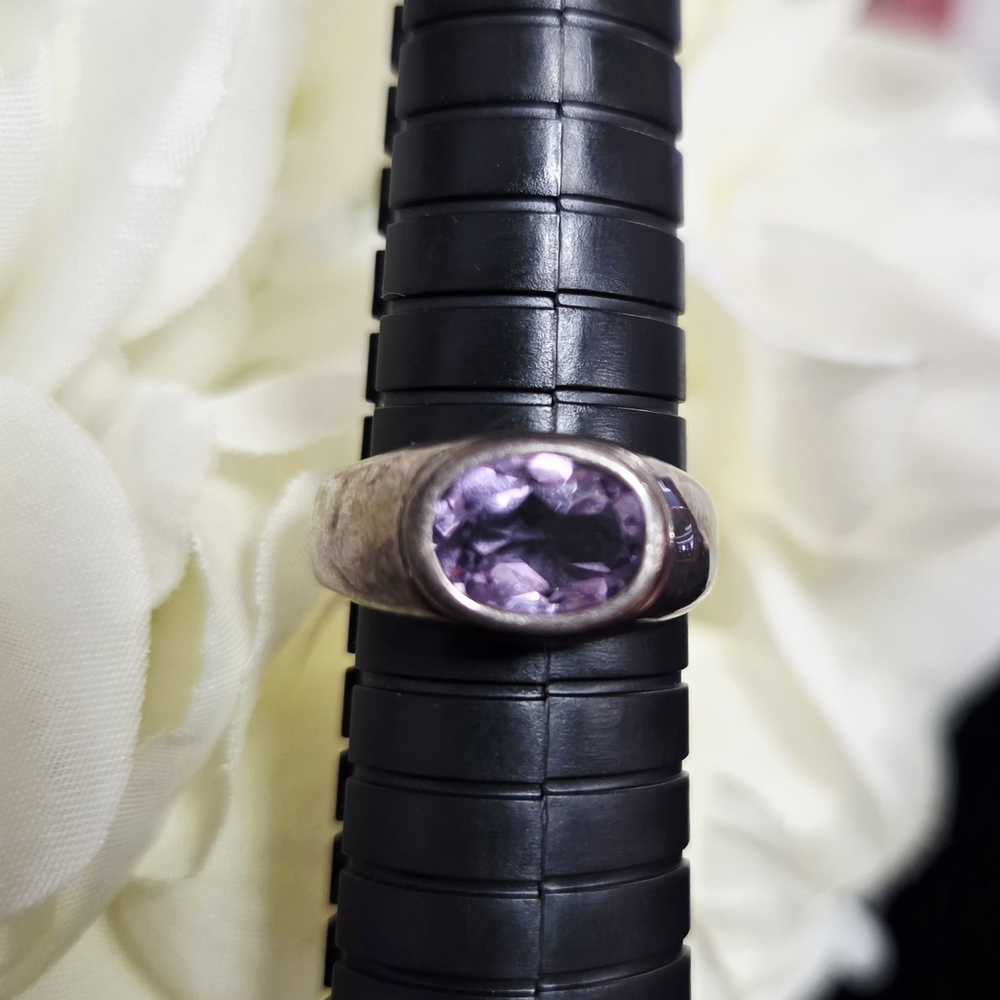 925 sterling silver ring with purple cubic zirconia.